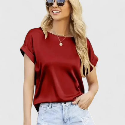Women's elegant loose-fit batwing sleeve blouse in a chic style, perfect for office or casual wear. O-neck design.