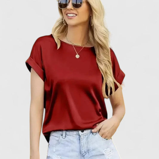 Women's elegant loose-fit batwing sleeve blouse in a chic style, perfect for office or casual wear. O-neck design.