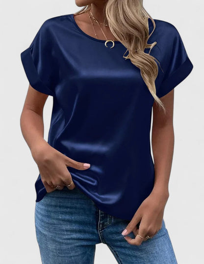 Chic women's loose-fit blouse with elegant batwing sleeves and a classic o-neck, ideal for summer fashion.