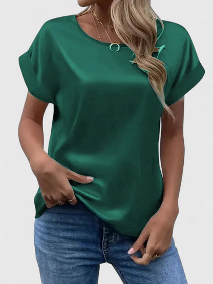 Stylish women's elegant batwing top. Loose-fit blouse offering relaxed comfort for casual or office attire.