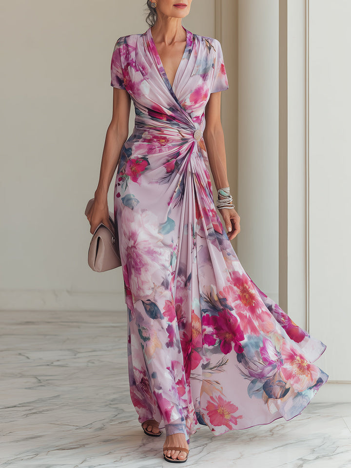 Women's elegant magenta floral wrap maxi dress with V-neck, short sleeves, and ruched waist for special occasions.