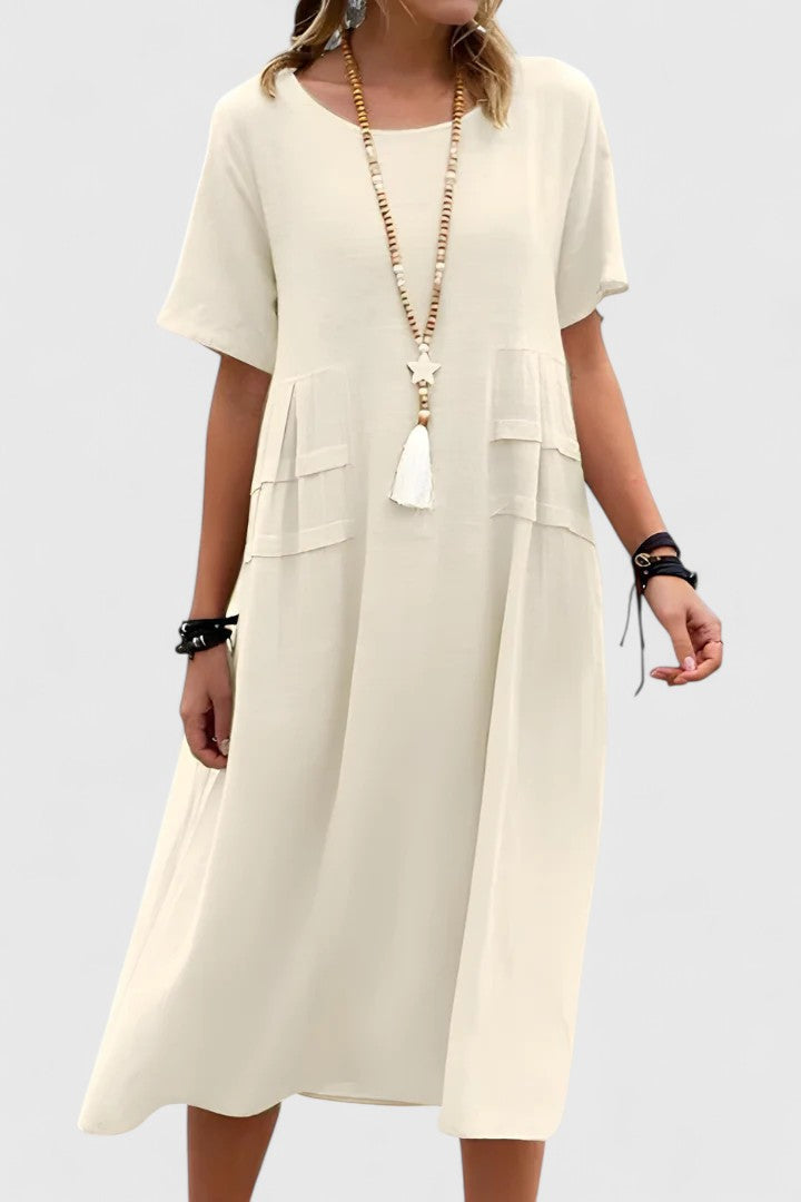 Women's elegant midi dress in a flattering style, perfect for versatile day-to-night wear. Comfortable & chic.