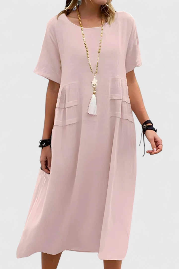 Chic pink women's midi dress, elegant and flattering for parties or special occasions. A versatile addition to any wardrobe.