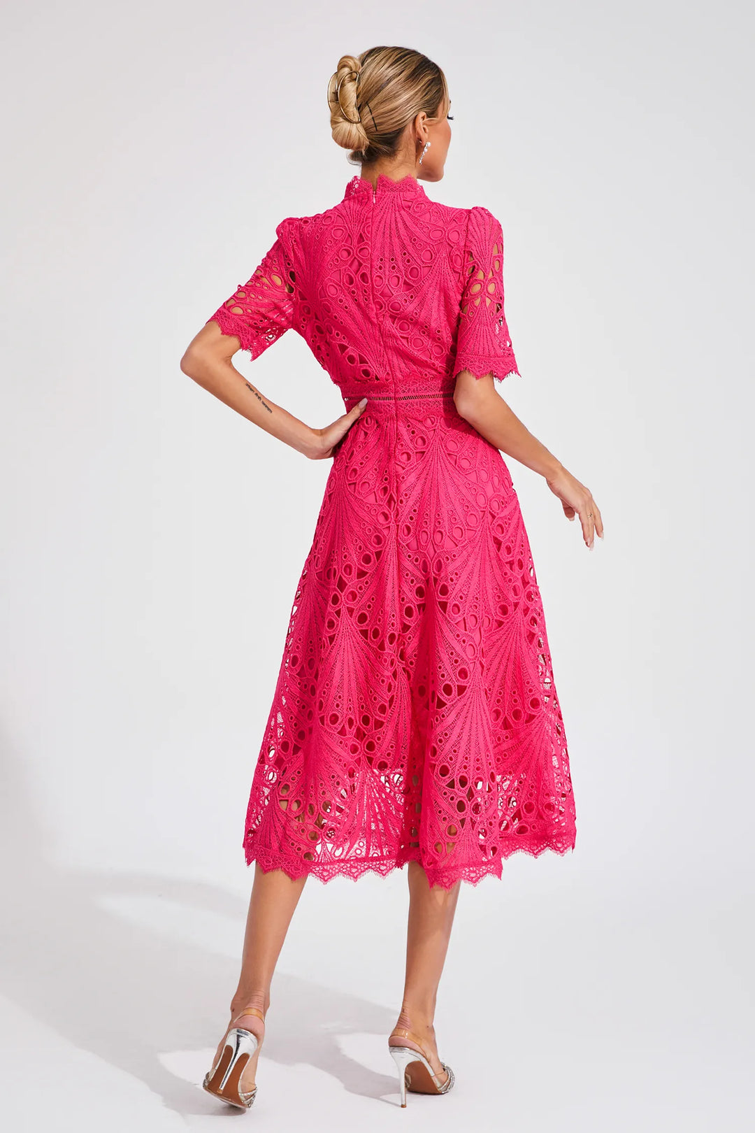 Women's elegant midi dress, a stunning special occasion piece. Perfect tailored wedding guest attire for spring.