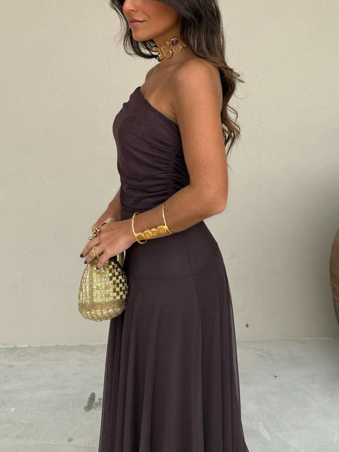 Sophisticated women's off-shoulder maxi dress, flowing A-line, suitable for elegant formal wear.