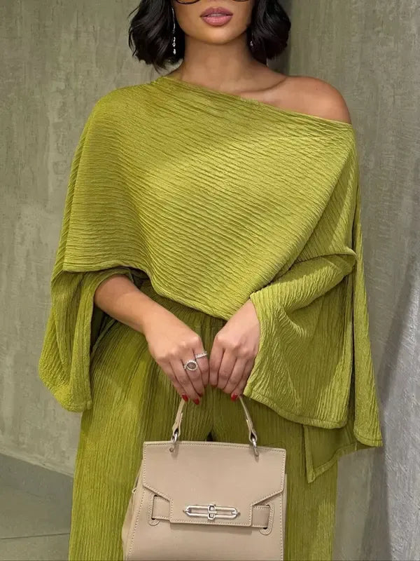 Women's elegant one-shoulder pleated chiffon two-piece set with wide-leg pants, ideal for summer resort wear.