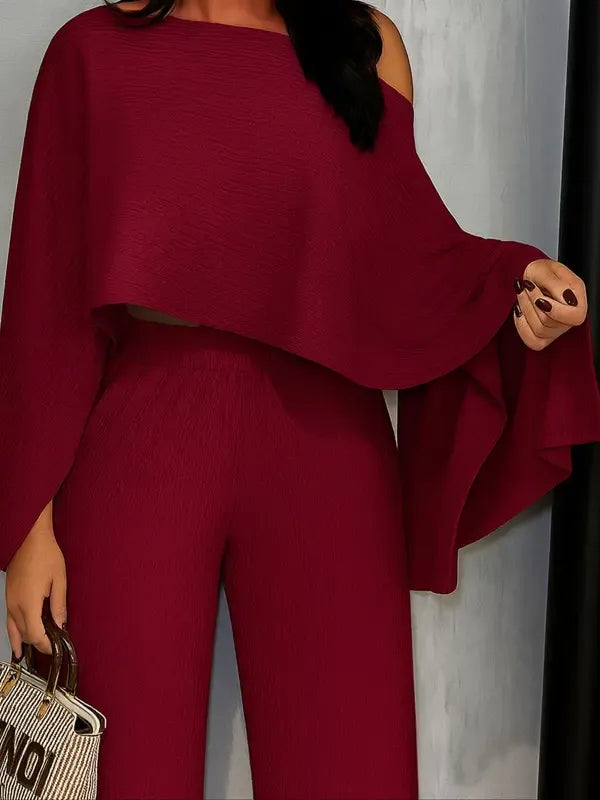 Elegant women's pleated one-shoulder blouse & matching wide-leg pants set, perfect for spring/summer occasions.