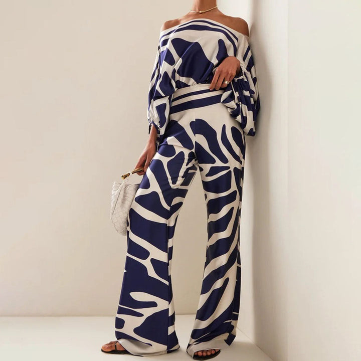 Flowy women's one-shoulder abstract print two-piece set, perfect for elegant summer fashion or stylish resort wear.