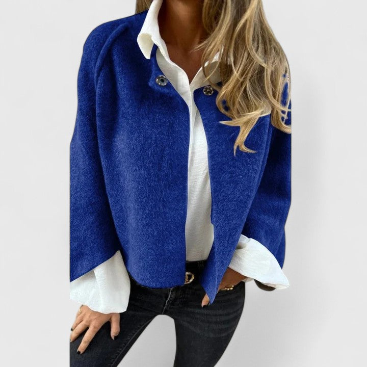Fashionable women's open-front jacket, sleek long sleeve design for an elegant, modern look.