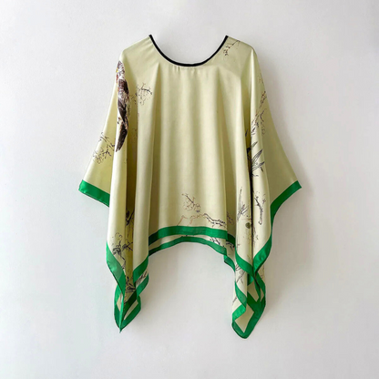 Stylish women's patterned shawl, draped elegantly. A versatile fashion accessory for modern outfits and occasions.