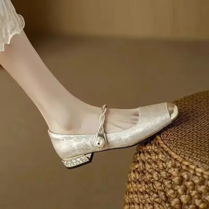Elegant women's pearl flats, designed with a metallic toe and soft cushioned comfort.