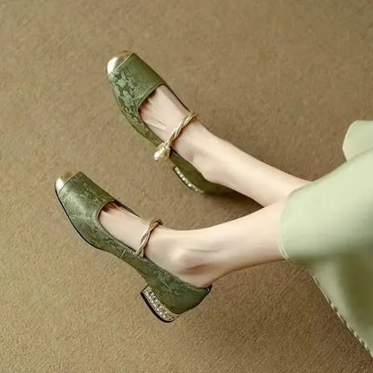 Women's sophisticated pearl flats, offering all-day comfort with their orthopedic design and low heel.