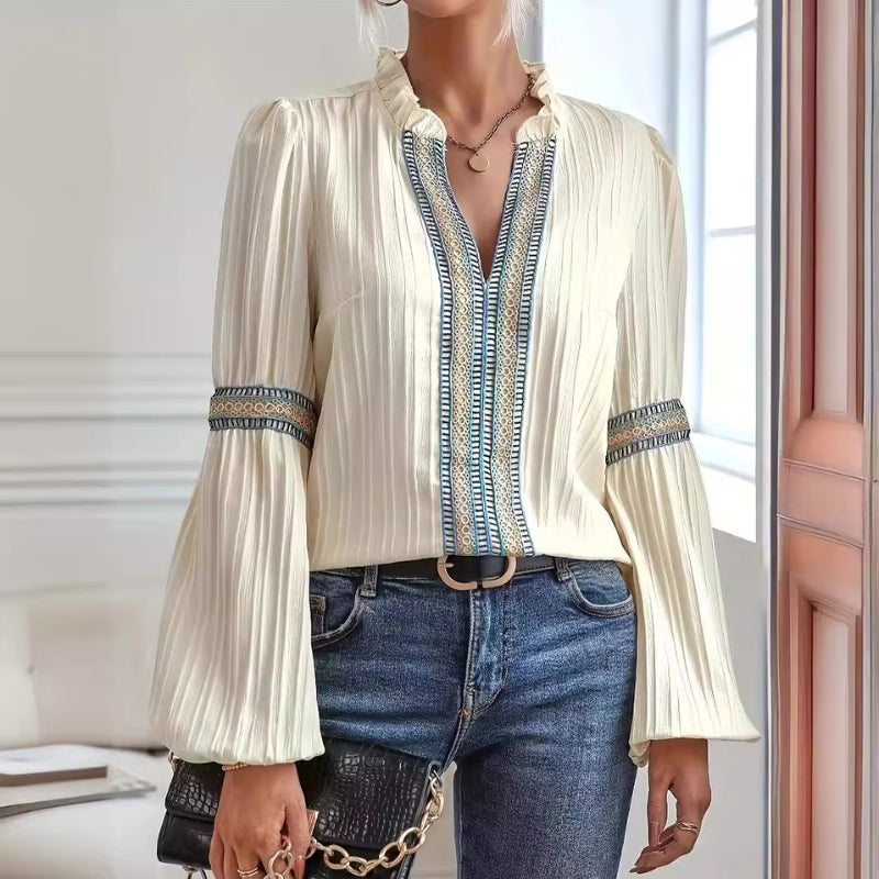 Women's elegant pleated blouse with delicate lace trim, perfect for sophisticated office wear or chic casual outfits.