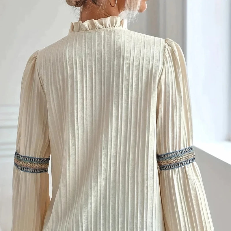 Chic pleated blouse for women with beautiful lace trim, ideal for elegant fashion, office attire, or special occasions.