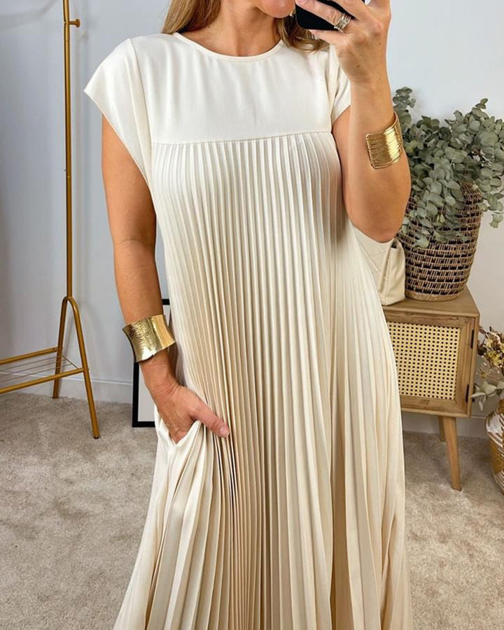 Women's elegant pleated maxi dress with a flowing design, perfect for versatile summer occasions.