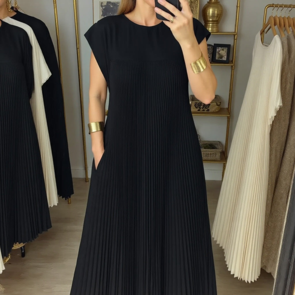 Chic women's long pleated dress, a flowing maxi style perfect for both casual and elegant occasions.