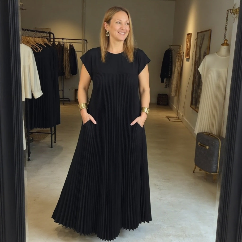 Graceful women's pleated maxi dress, designed with a flowing skirt for elegant movement and comfort.