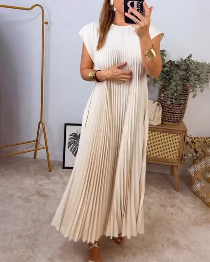 Occasion-ready women's pleated maxi dress, featuring a luxurious flowing design and comfortable fit.