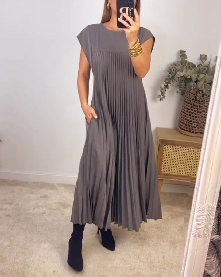 Versatile women's maxi dress, featuring elegant pleats and a graceful flowing design for any event.