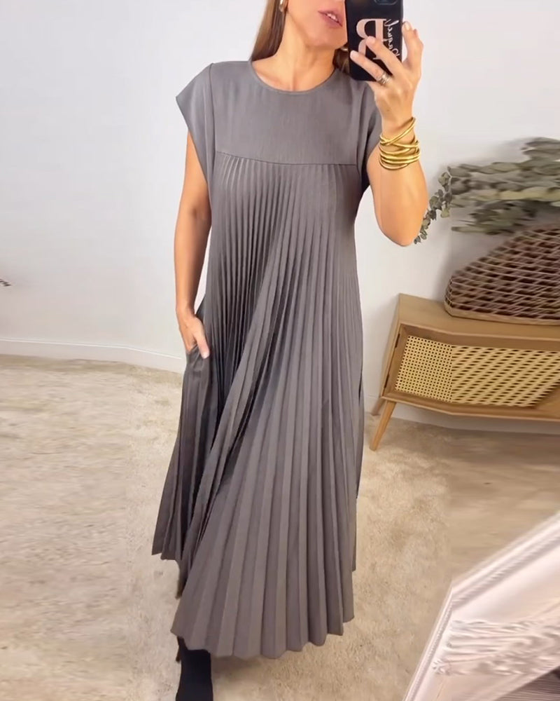 Elegant women's occasion wear: a comfortable pleated maxi dress with a stunning flowing silhouette.