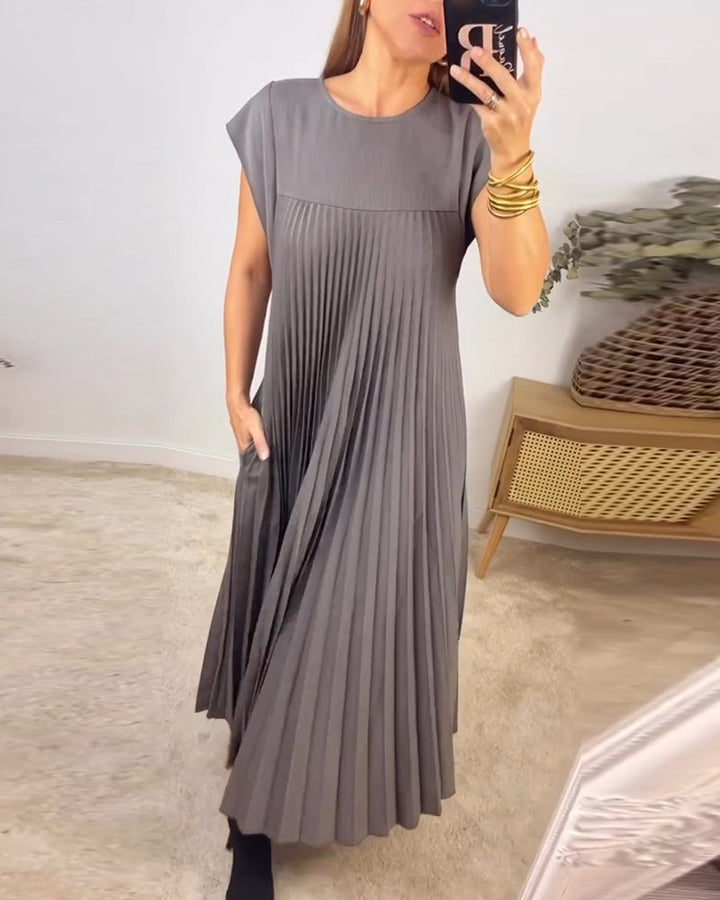 Elegant women's occasion wear: a comfortable pleated maxi dress with a stunning flowing silhouette.