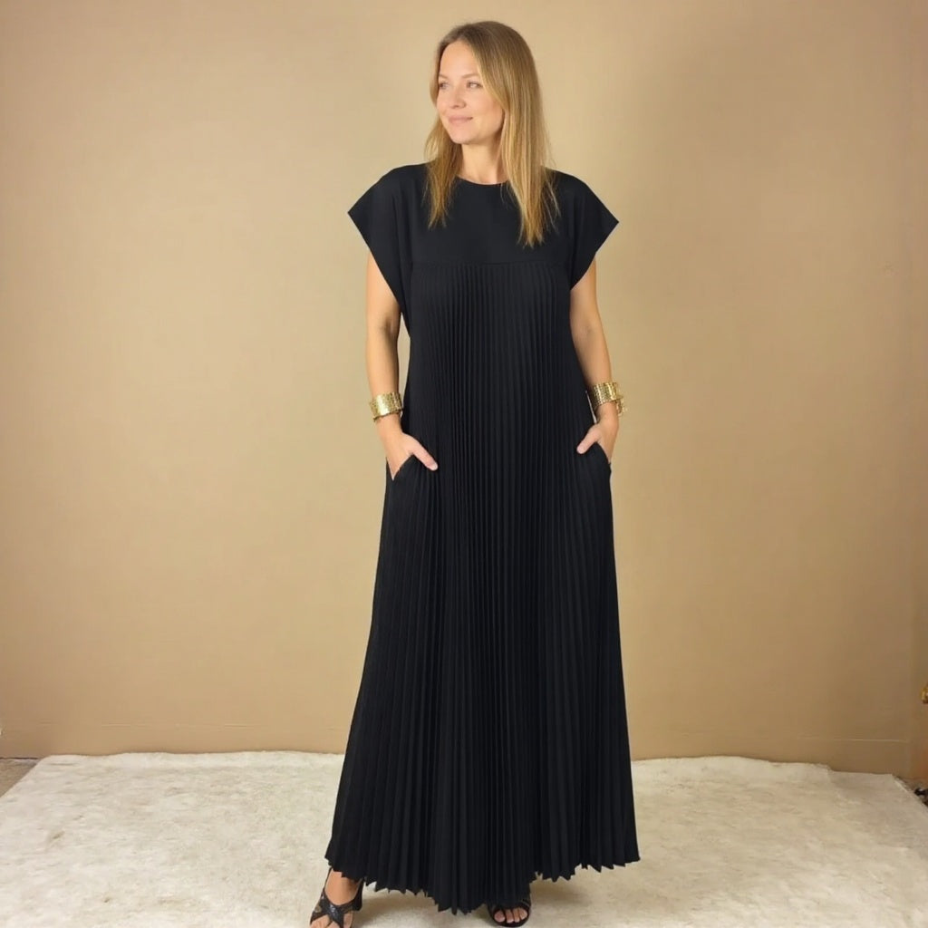 Women's versatile flowing maxi dress with delicate pleats, offering an elegant and comfortable style.