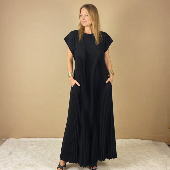 Women's versatile flowing maxi dress with delicate pleats, offering an elegant and comfortable style.