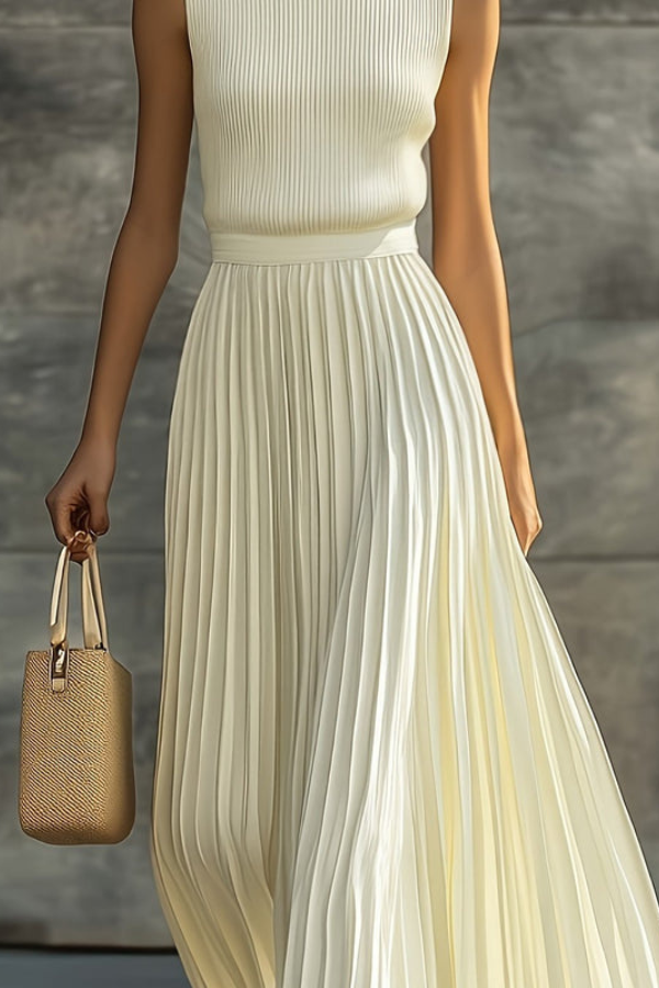 Graceful women's sleeveless pleated midi dress, ideal for day-to-night wear. Comfortable, chic, and flowy design.