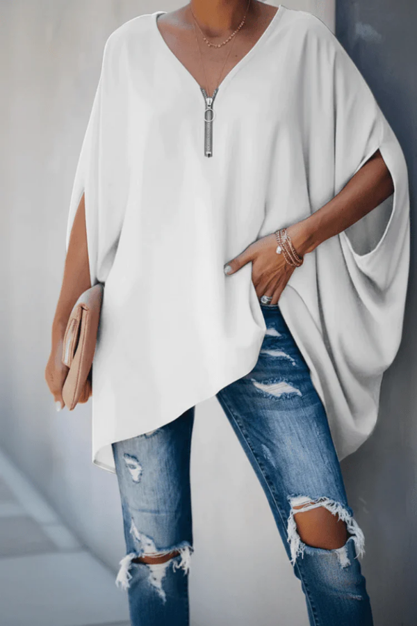 Crisp white women's pleated spring blouse with V-neck, a versatile top for elegant or casual looks.