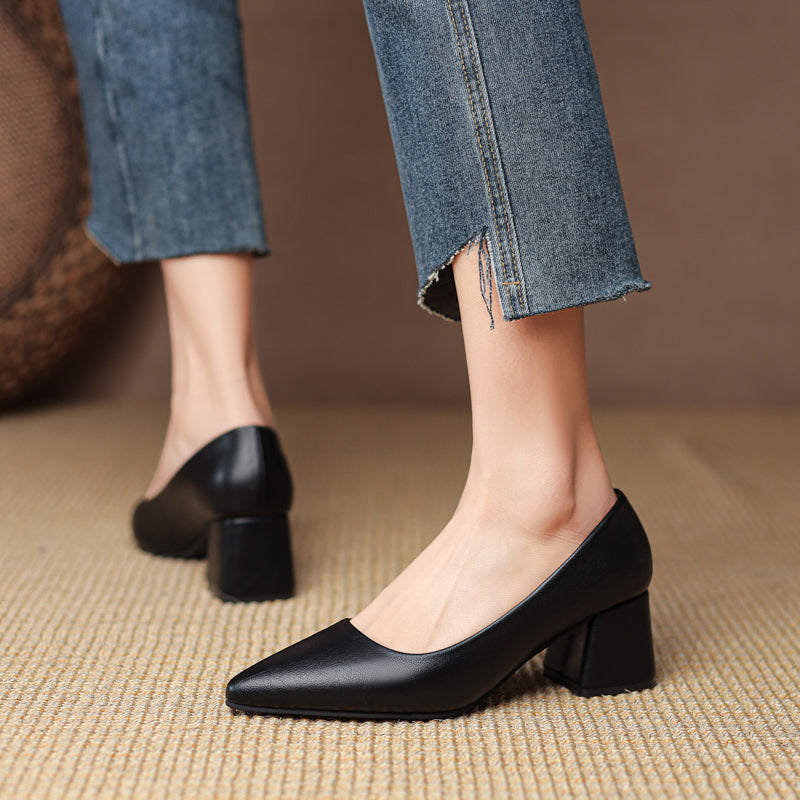 Front view: Sleek pointed toe women's pumps with block heel. Essential professional & formal footwear.
