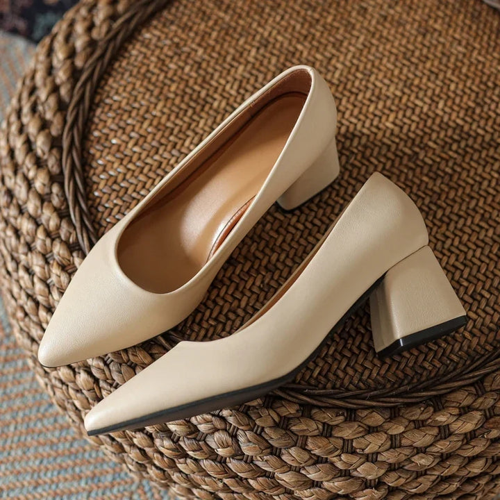 Classic women's pointed toe block heels. Elegant & versatile pumps for professional office attire & evening.