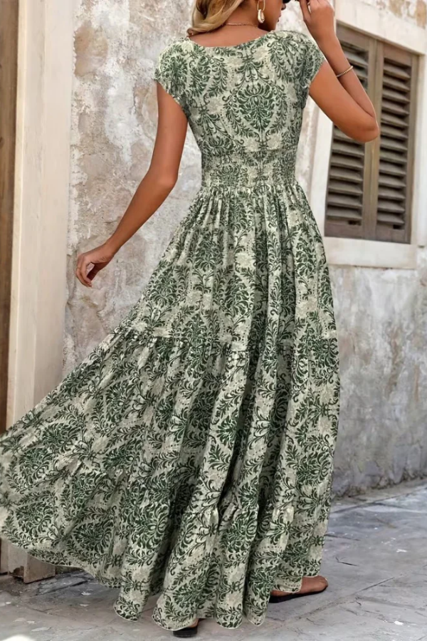 Women's elegant printed V-neck maxi dress, perfect for summer vacations. Flowing, comfortable, and versatile style.