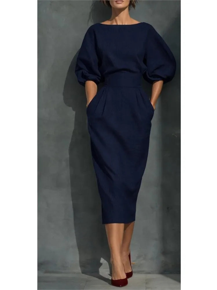 Stylish women's round neck midi dress featuring trendy puff sleeves and practical pockets.