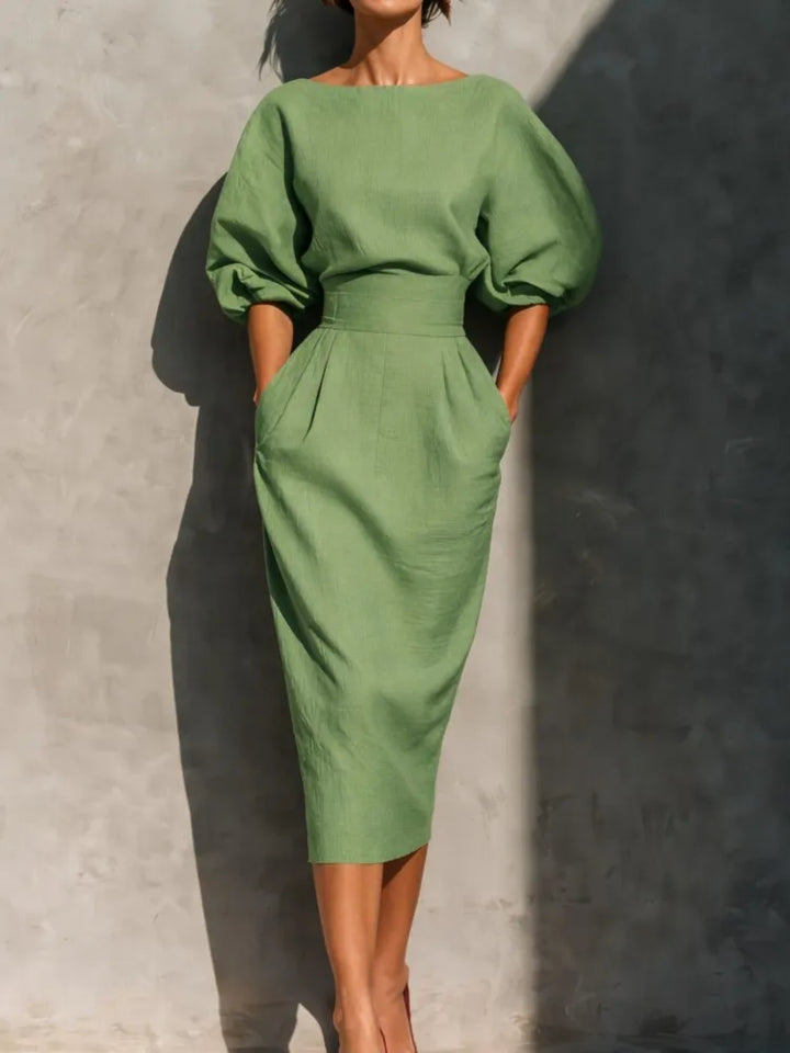 Comfortable & chic women's puff sleeve midi dress with pockets for spring, summer, and fall fashion.