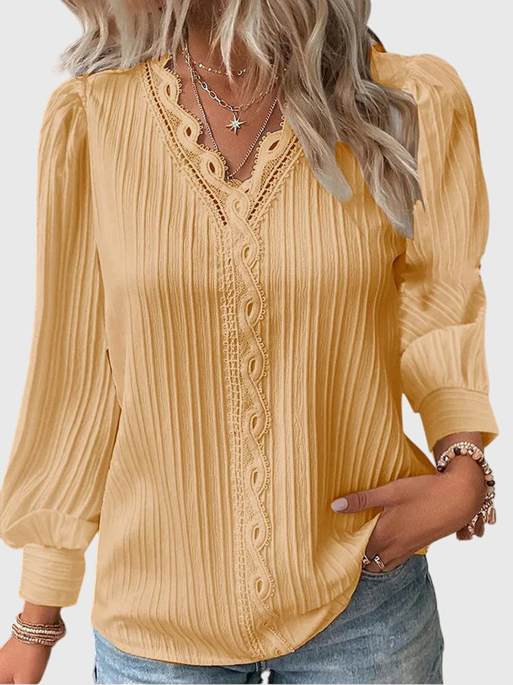 Women's elegant pullover blouse with long sleeves & round neck, perfect for work or casual chic style.
