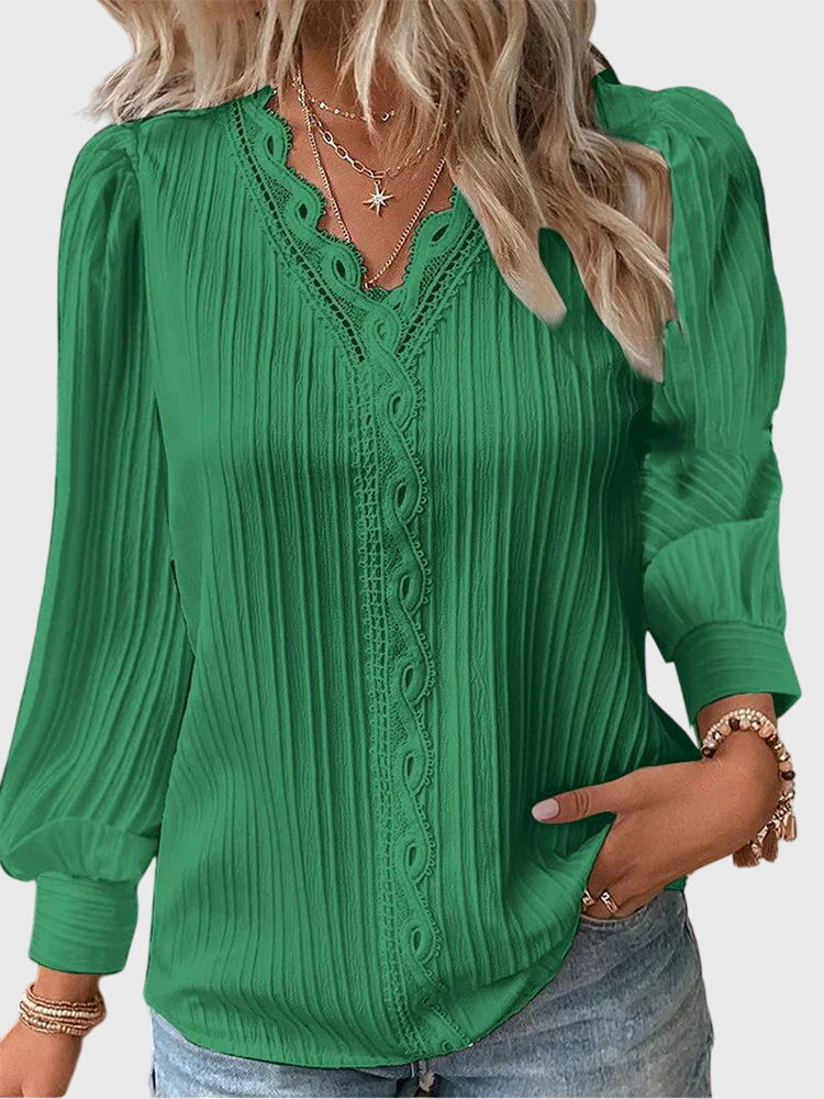 Stylish women's pullover top, versatile for office wear or an elegant everyday fashion look.