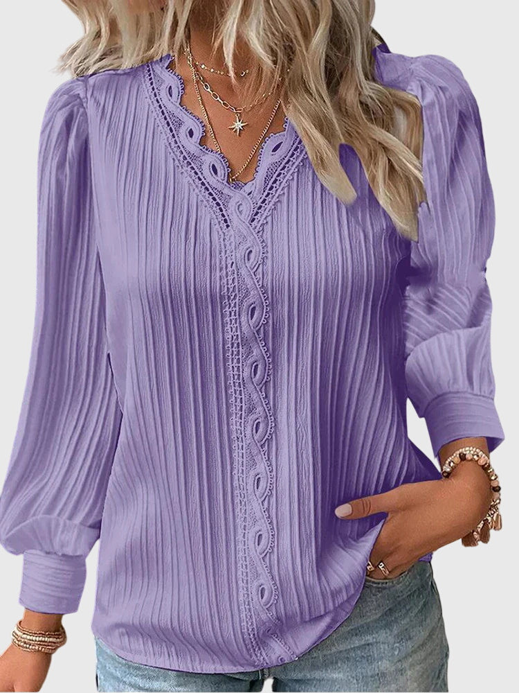 Modern women's fashion blouse, a comfortable long sleeve pullover suitable for various occasions.