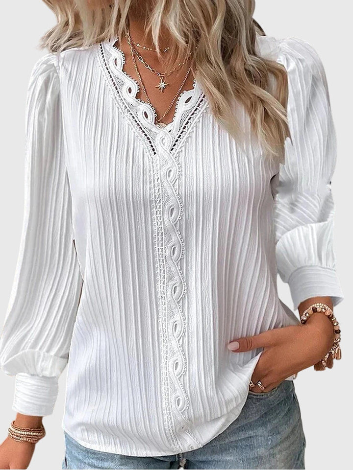 Effortlessly stylish women's pullover blouse, a versatile long sleeve top for elegant casual wear.
