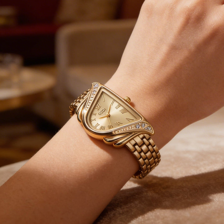 Women's elegant quartz watch with irregular rhombus dial. A modern gold fashion accessory timepiece.