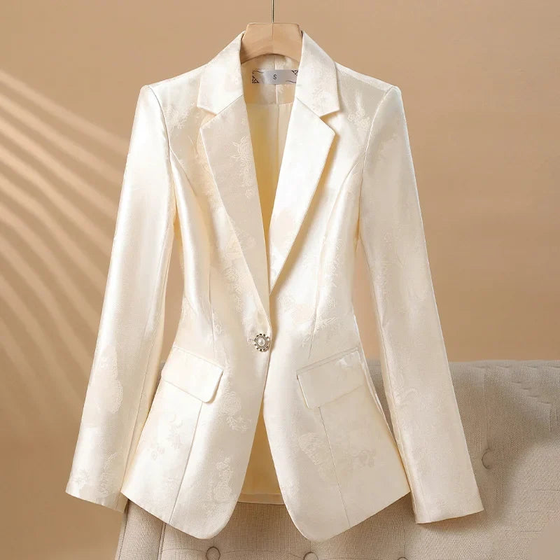 Chic women's tailored rosette blazer, a stunning statement piece with an exquisite jeweled button detail.