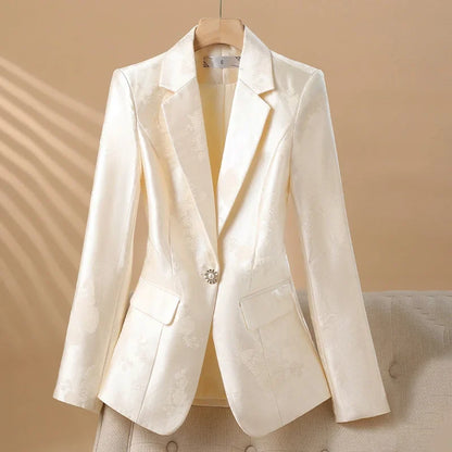 Chic women's tailored rosette blazer, a stunning statement piece with an exquisite jeweled button detail.