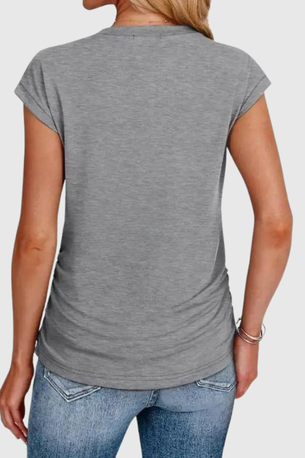 Stylish women's casual tunic with ruched side and ruffle sleeves. Effortless elegant everyday summer blouse.
