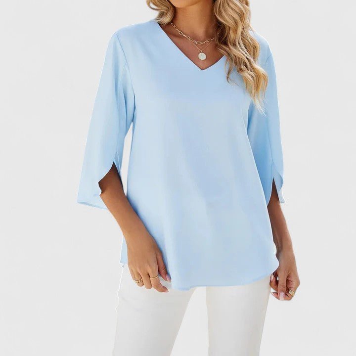 Professional women's blouse: V-neck, ruffles, and split sleeves for a polished office look.