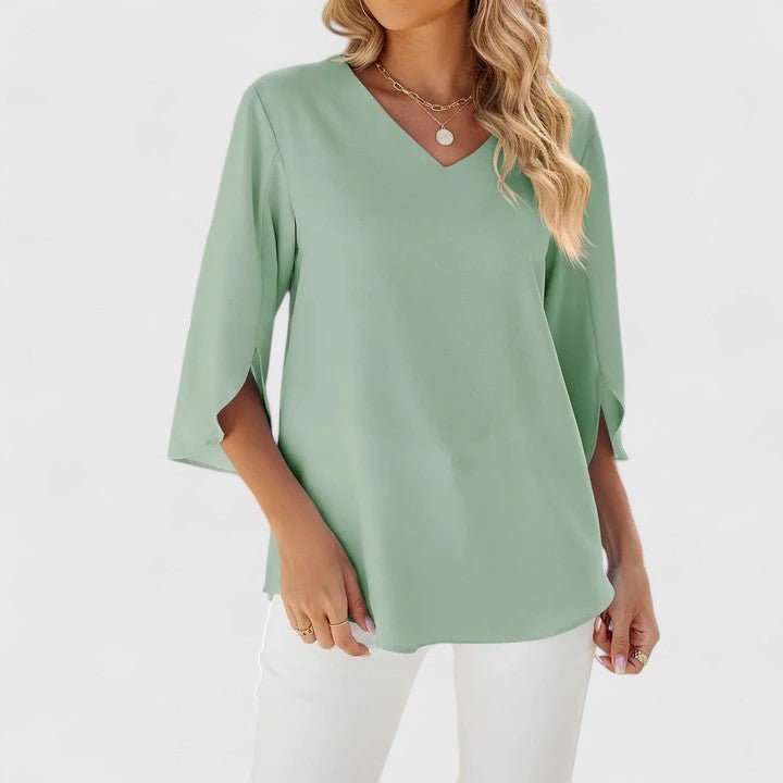 Sophisticated women's V-neck ruffle blouse with elegant split sleeves for summer style.