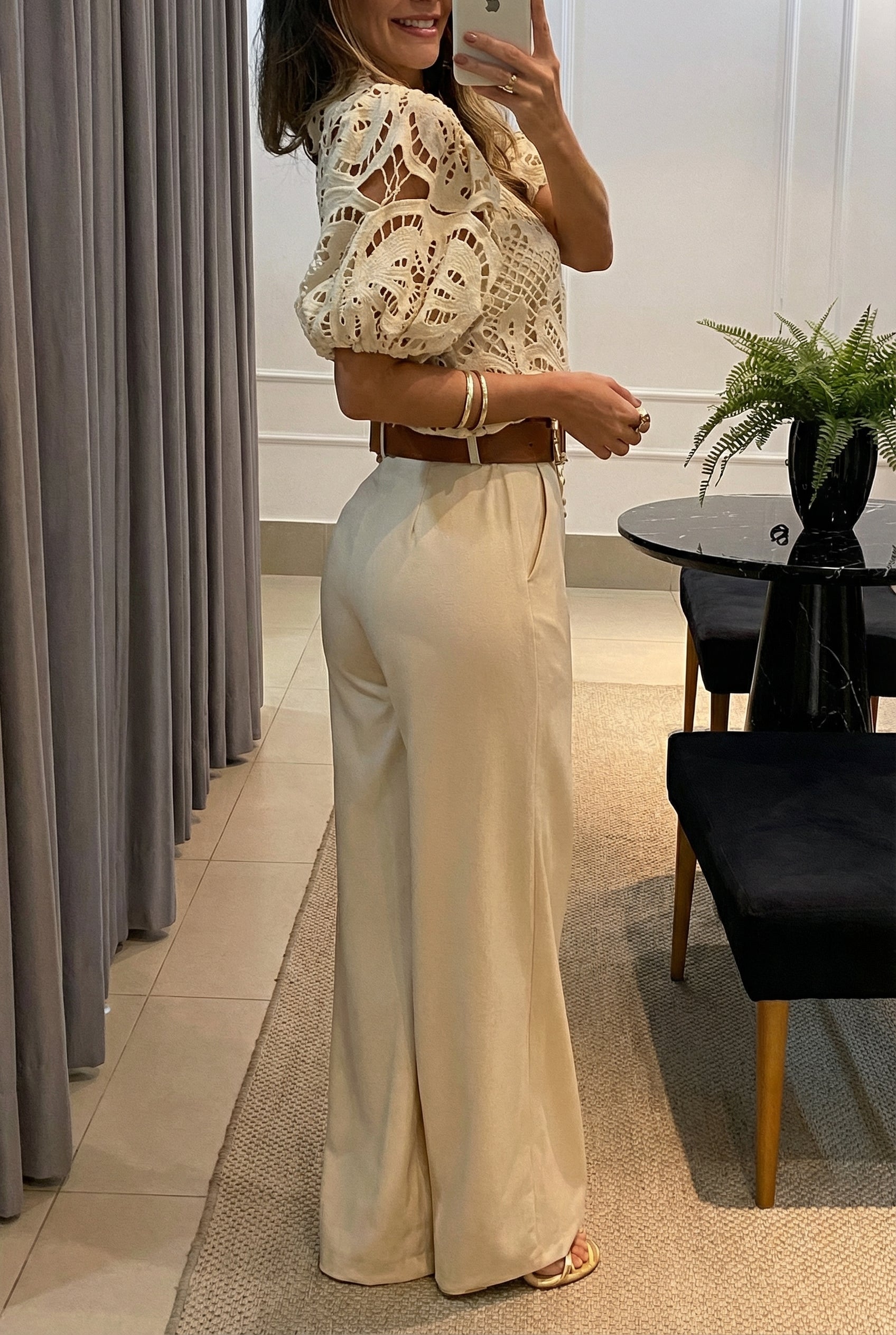 Neutral women's elegant set: sheer puff sleeve blouse and tailored high-waist pants. Chic formal & office wear.