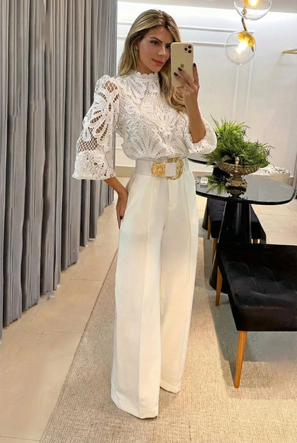 Modern women's sheer blouse & tailored high-waist pants set. Versatile for elegant formal, office, or events.