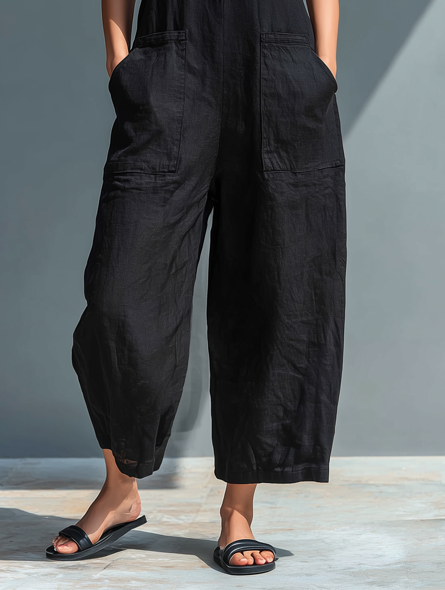 Elegant sleeveless resort wear jumpsuit for women. Comfortable, chic, & polished with mandarin collar detail.
