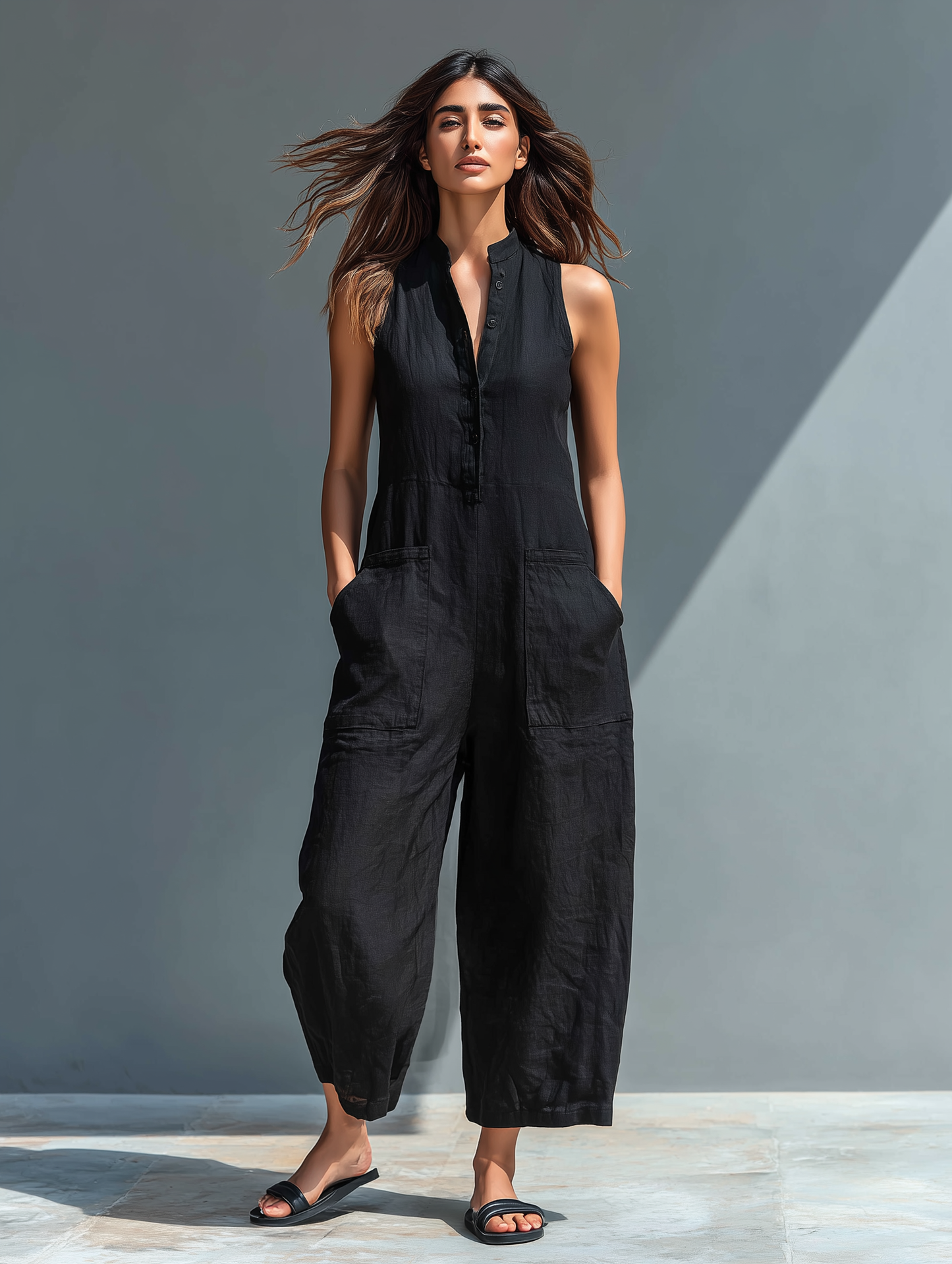 Stylish women's sleeveless jumpsuit for summer & spring. Versatile, elegant, & comfortable with button front.