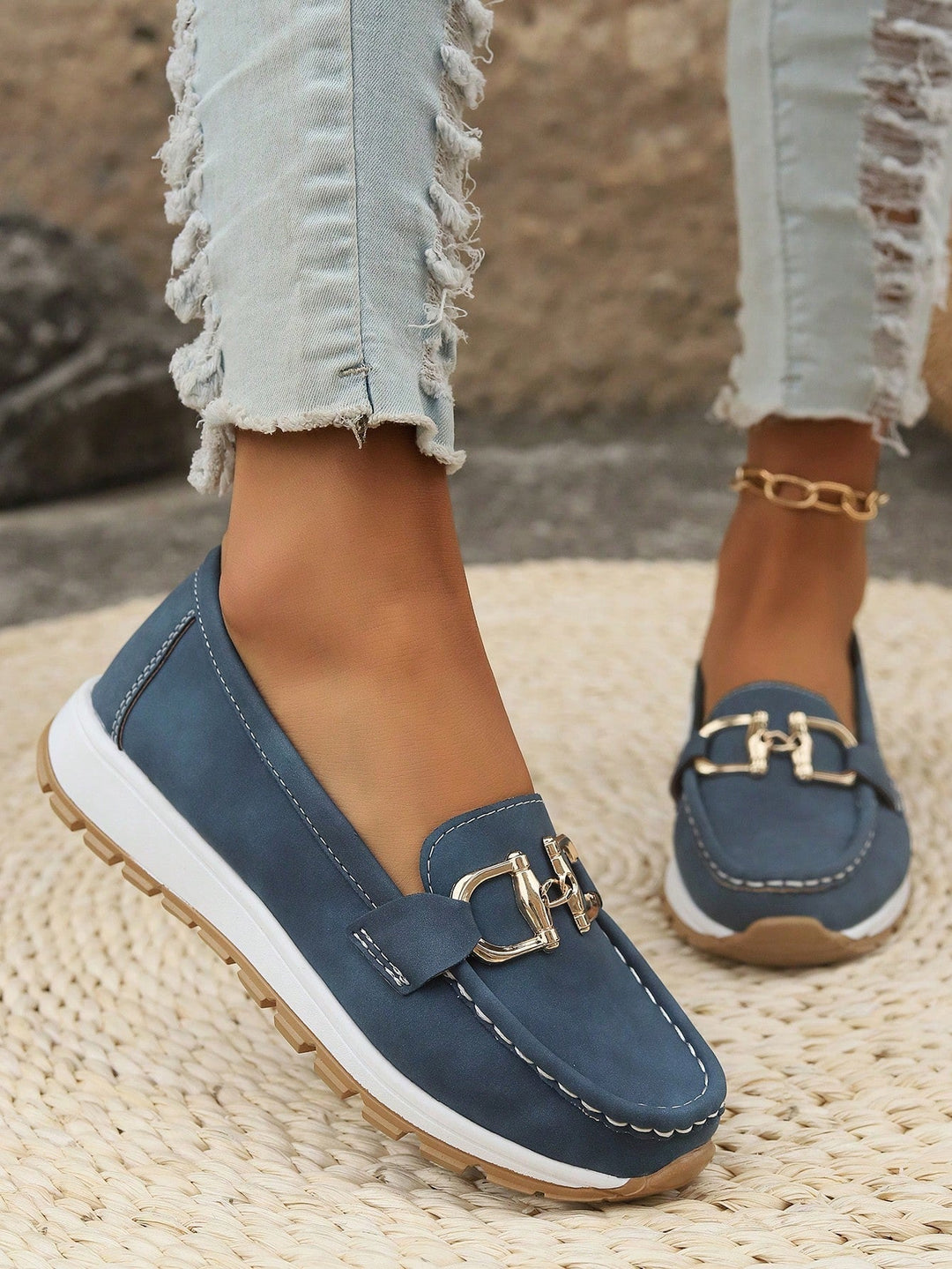Practical women's work shoes: comfortable slip-on loafers with an elegant gold buckle detail.