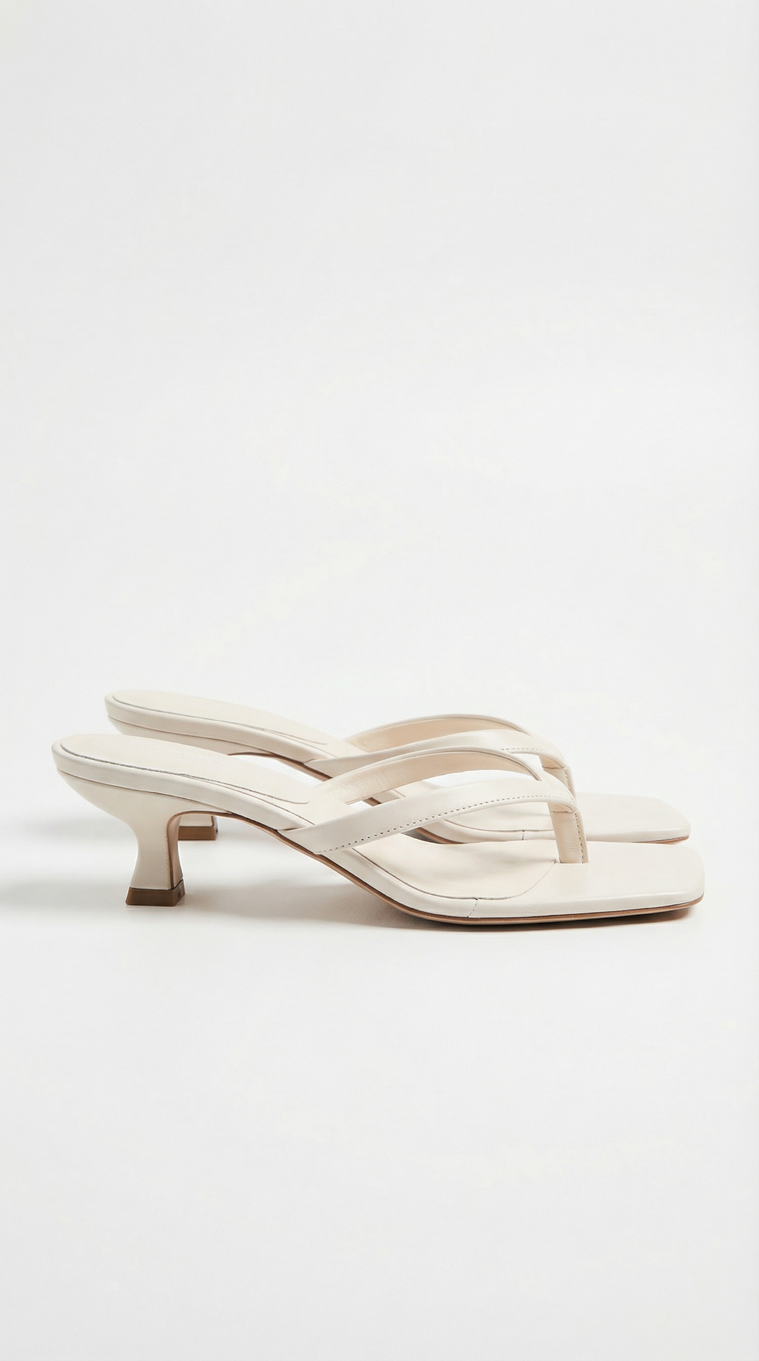 Chic women's square toe thong kitten heel sandals, designed for a sophisticated summer fashion statement.